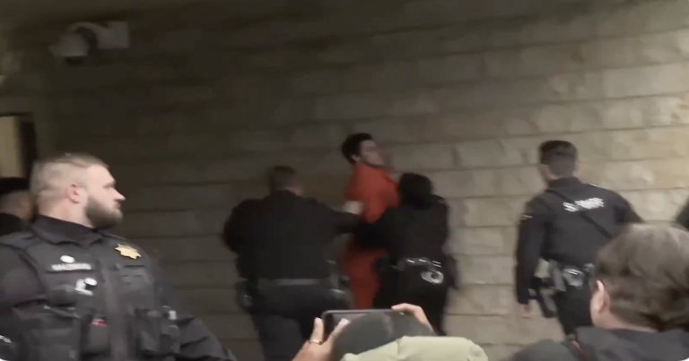 BREAKING VIDEO: Alleged CEO Killer Goes Crazy, Shouts at Reporters Outside Court